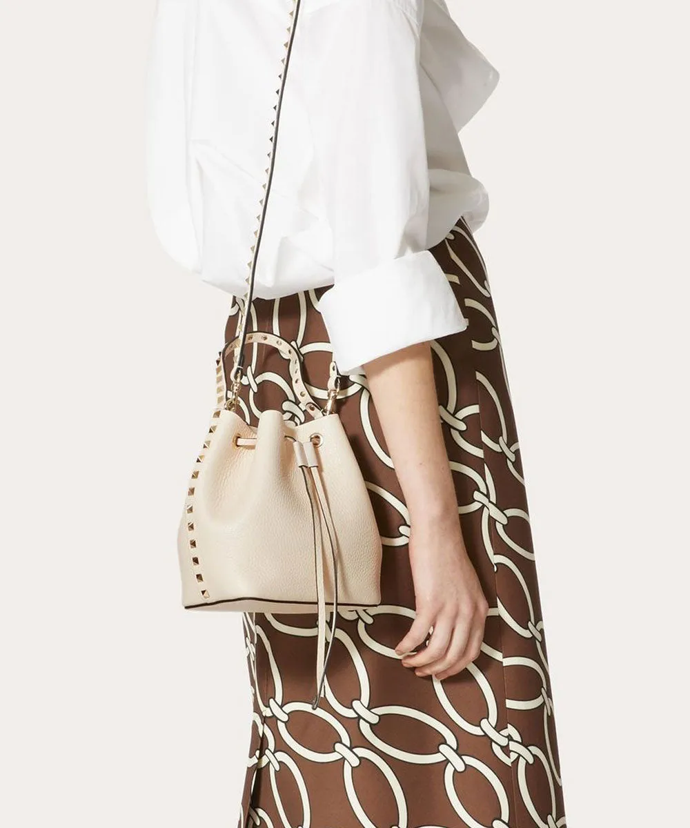 Rockstud Textured Leather Bucket Bag In Light Ivory